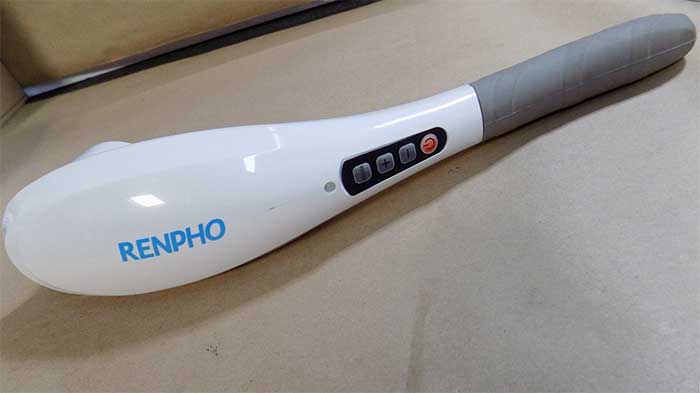 Renpho therapeutic massager on a couch